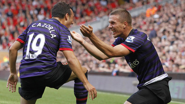 Cazorla and Podolski celebrating a goal/ PHOTO: Skysports