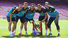 Team photo shoot with league trophy