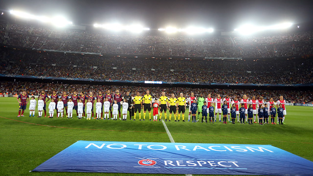 The Barça and Ajax players line up before the game at the Camp Nou